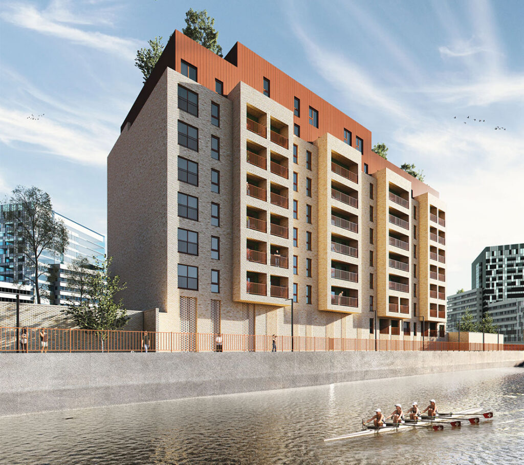 Modern waterside apartment development with a rowing crew on the river below.