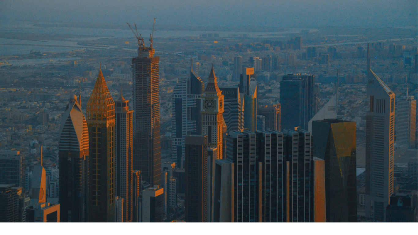 Modern global city financial district skyline at sunset representing NEBA's international reach